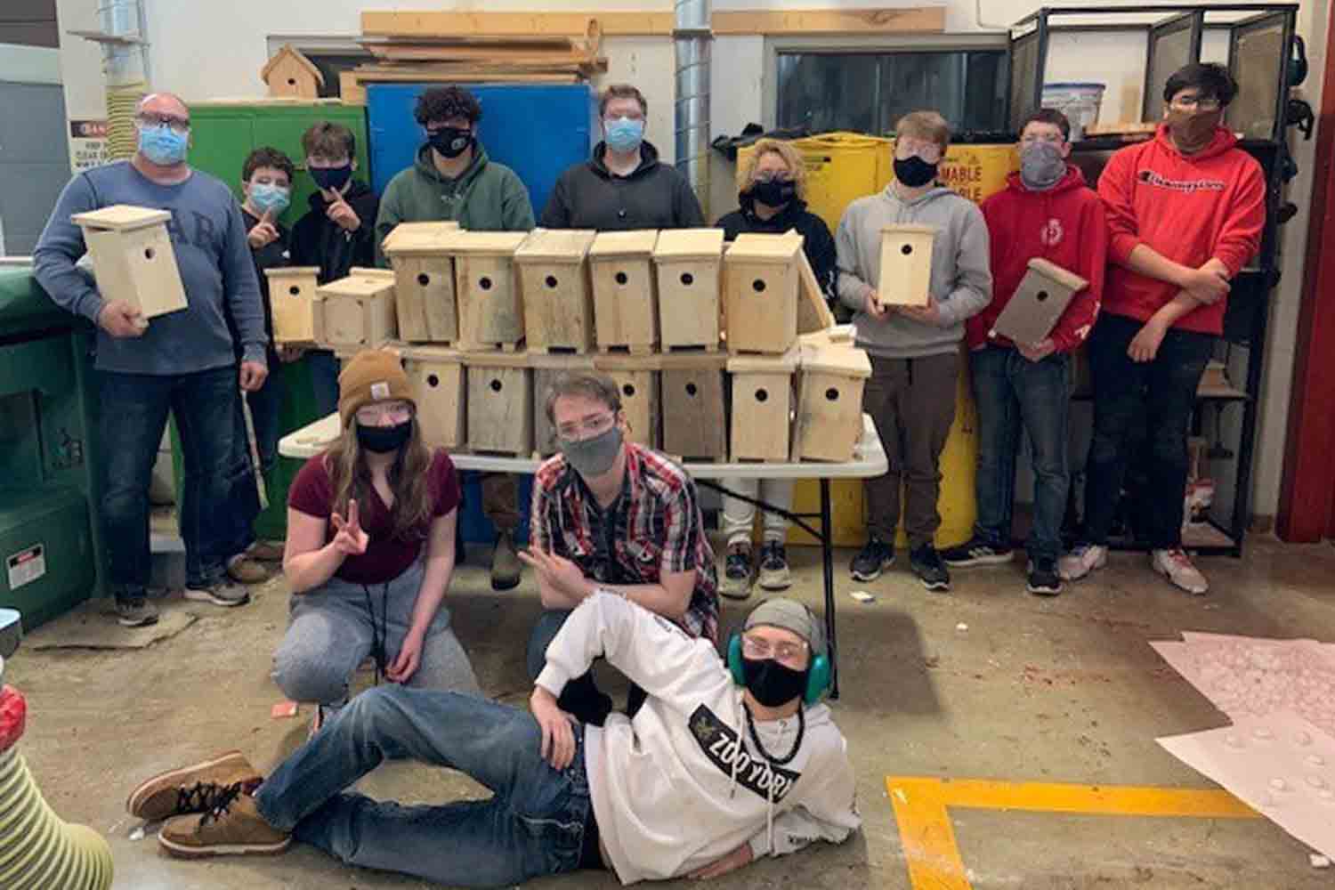 Timmins High and Vocational School class with the swallow boxes they built
